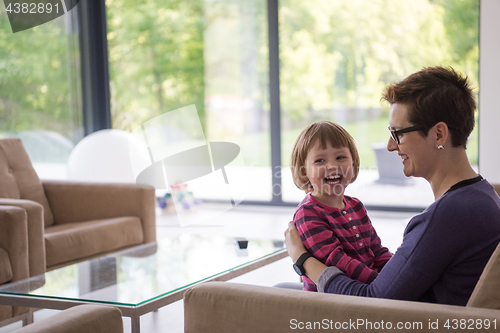 Image of mother and cute little girl enjoying their free time