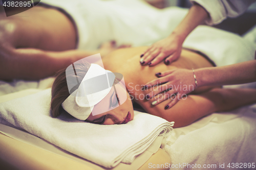 Image of couple receiving a back massage