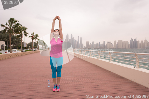 Image of woman stretching and warming up