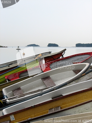 Image of A stack of boats on a shore