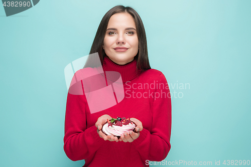 Image of Beautiful women holding small cake. Birthday, holiday.