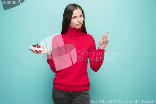 Image of Beautiful women holding small cake. Birthday, holiday.