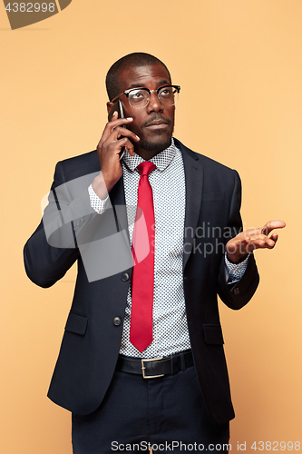 Image of Young african business man on the phone