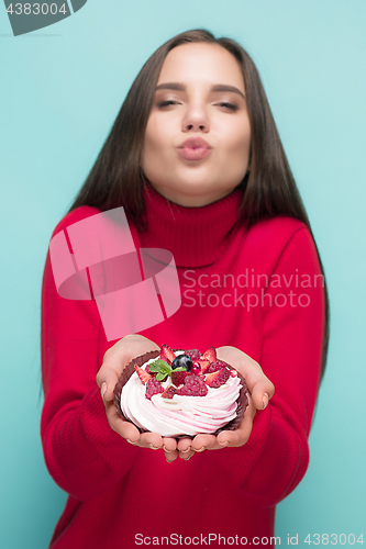 Image of Beautiful women holding small cake. Birthday, holiday.