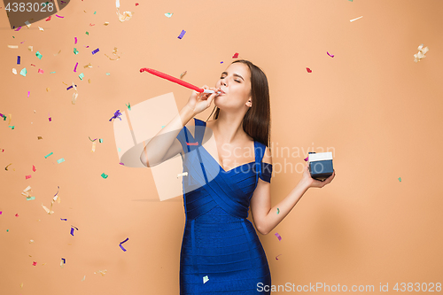 Image of The woman celebrating birthday on brown background