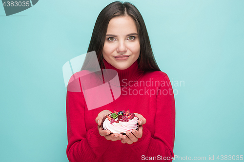 Image of Beautiful women holding small cake. Birthday, holiday.
