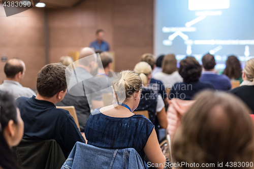 Image of Speaker giving presentation on health care conference.