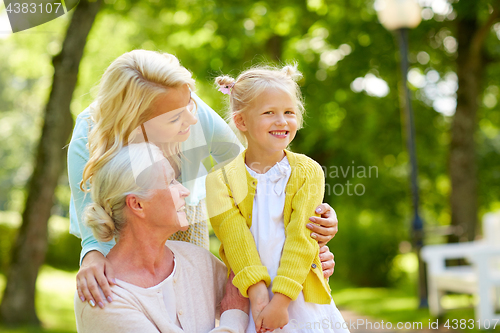 Image of happy mother, daughter and grandmother at park