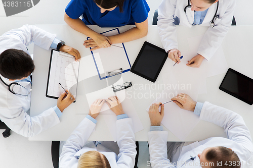 Image of doctors with cardiograms and tablet pc at hospital