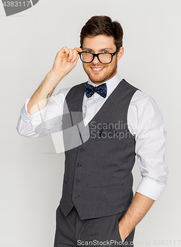 Image of happy man in festive suit and eyeglasses