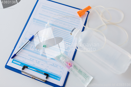 Image of close up of medical report and drop counter