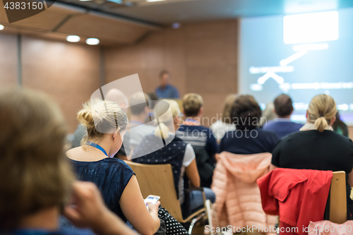 Image of Speaker giving presentation on health care conference.