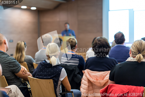 Image of Speaker giving presentation on health care conference.