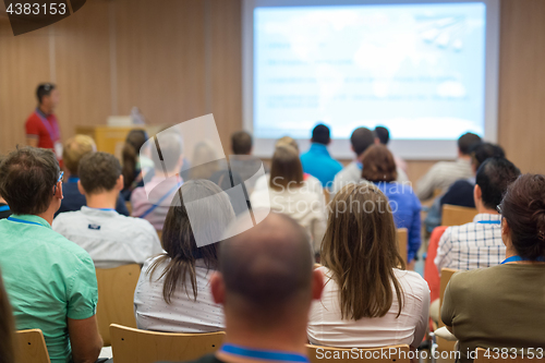 Image of Speaker giving presentation on health care conference.