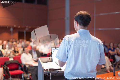 Image of Speaker at Business Conference and Presentation.