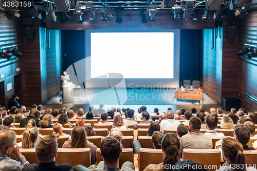 Image of Speaker giving presentation on health care conference.