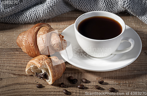 Image of Black coffee with croissants