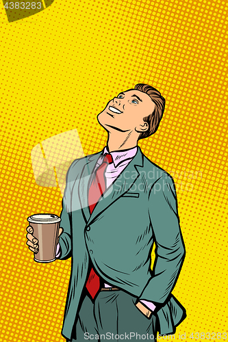 Image of Businessman drinking coffee and looking up