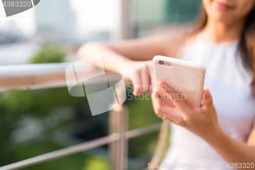 Image of Woman using mobile phone