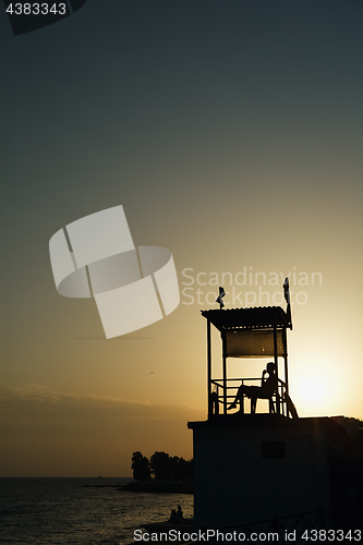 Image of Anonymous person sitting in observation tower