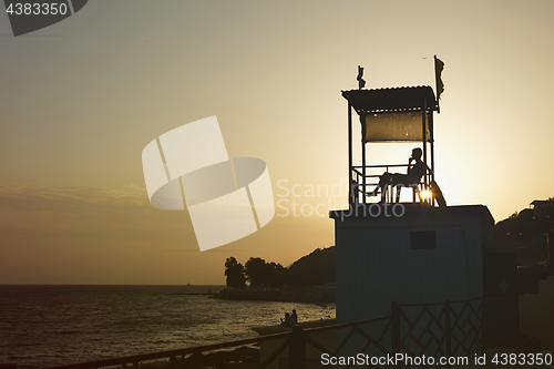 Image of Anonymous person sitting in observation tower