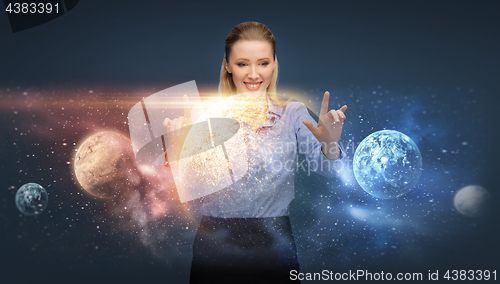 Image of happy businesswoman with virtual planets and space