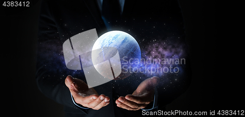 Image of close up of businessman with planet hologram