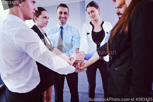 Image of business people group joining hands