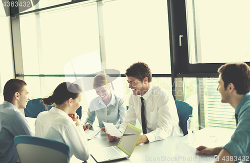 Image of business people in a meeting at office