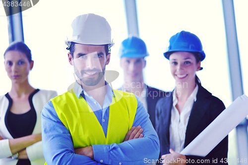 Image of business people and construction engineers on meeting