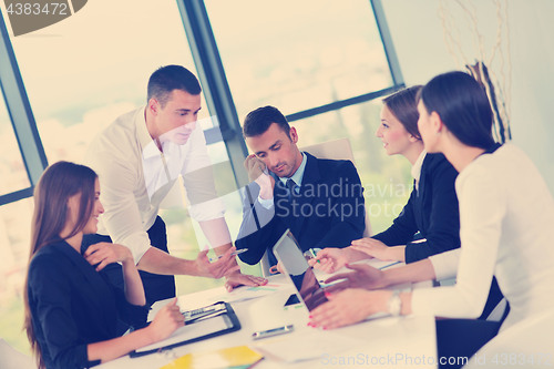 Image of business people group in a meeting at office