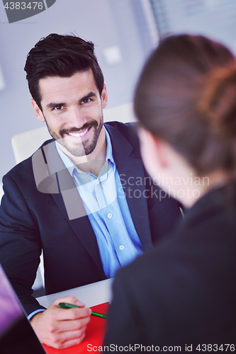 Image of business people in a meeting at office