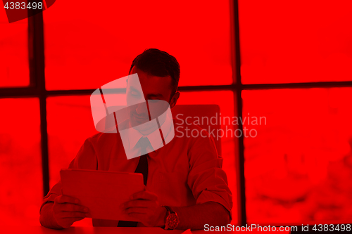 Image of business man using tablet compuer at office