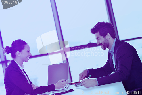 Image of business people in a meeting at office