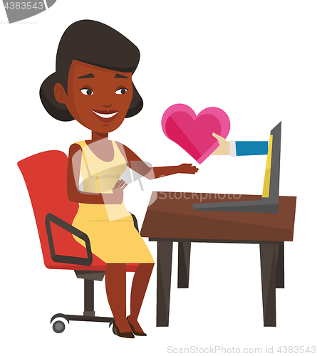 Image of Young woman dating online using laptop.