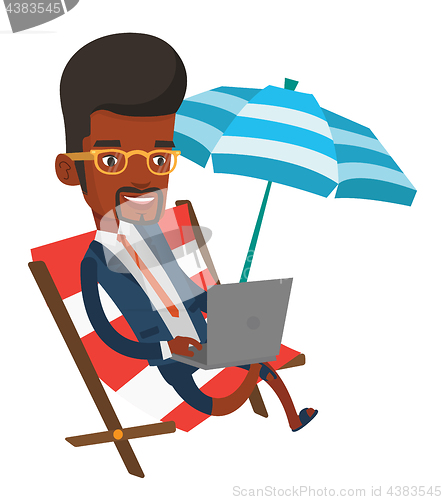 Image of Business man working on laptop at the beach.