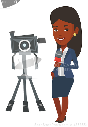 Image of TV reporter with microphone and camera.