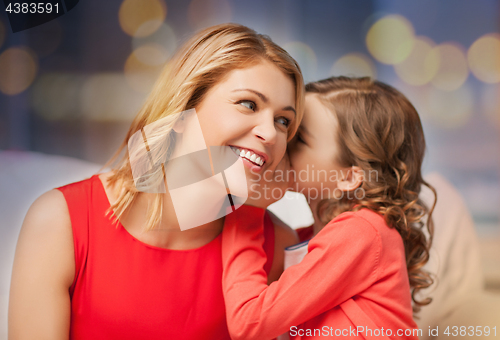 Image of happy mother and girl whispering into ear