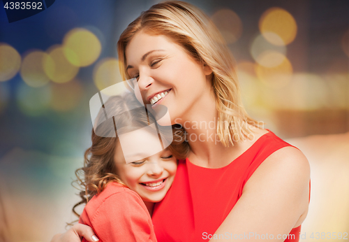Image of happy mother and daughter hugging