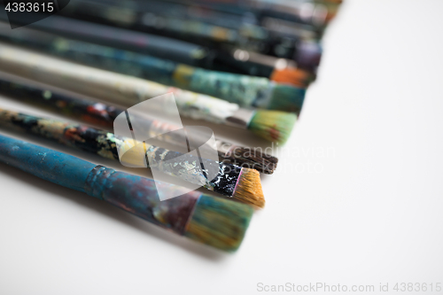 Image of close up of dirty paintbrushes