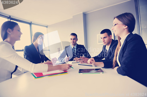 Image of business people group in a meeting at office