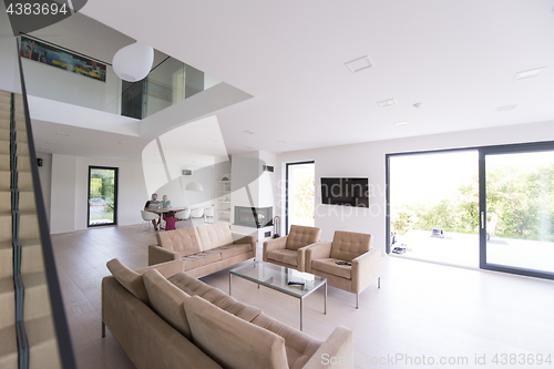 Image of family with little girl enjoys in the modern living room