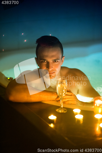 Image of man relaxing in the jacuzzi