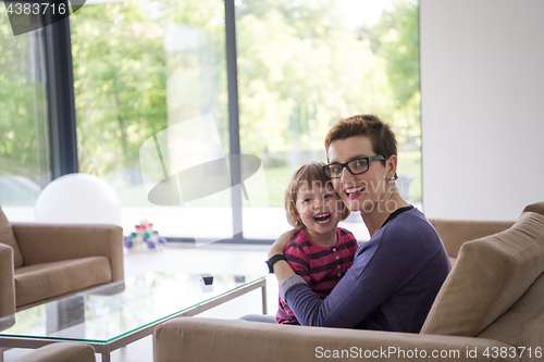 Image of mother and cute little girl enjoying their free time