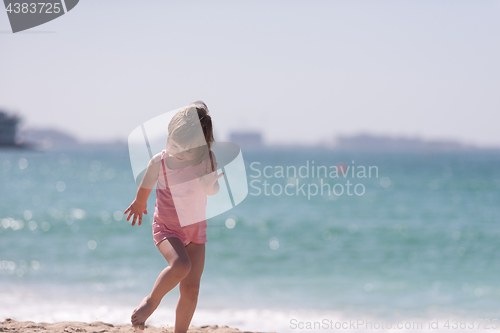 Image of little cute girl at beach