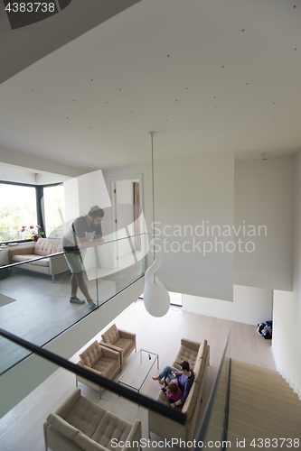 Image of family with little girl enjoys in the modern living room