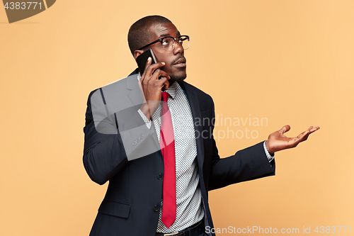 Image of Young african business man on the phone