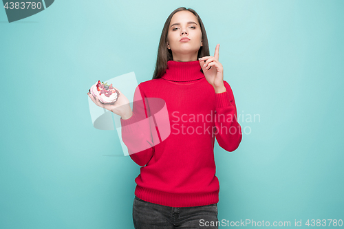 Image of Beautiful women holding small cake. Birthday, holiday.