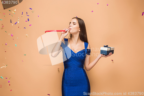Image of The woman celebrating birthday on brown background