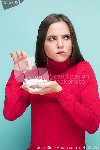 Image of Beautiful women holding small cake. Birthday, holiday.